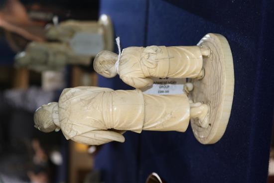 A Japanese ivory group of two figures with basket of oranges height 16cm